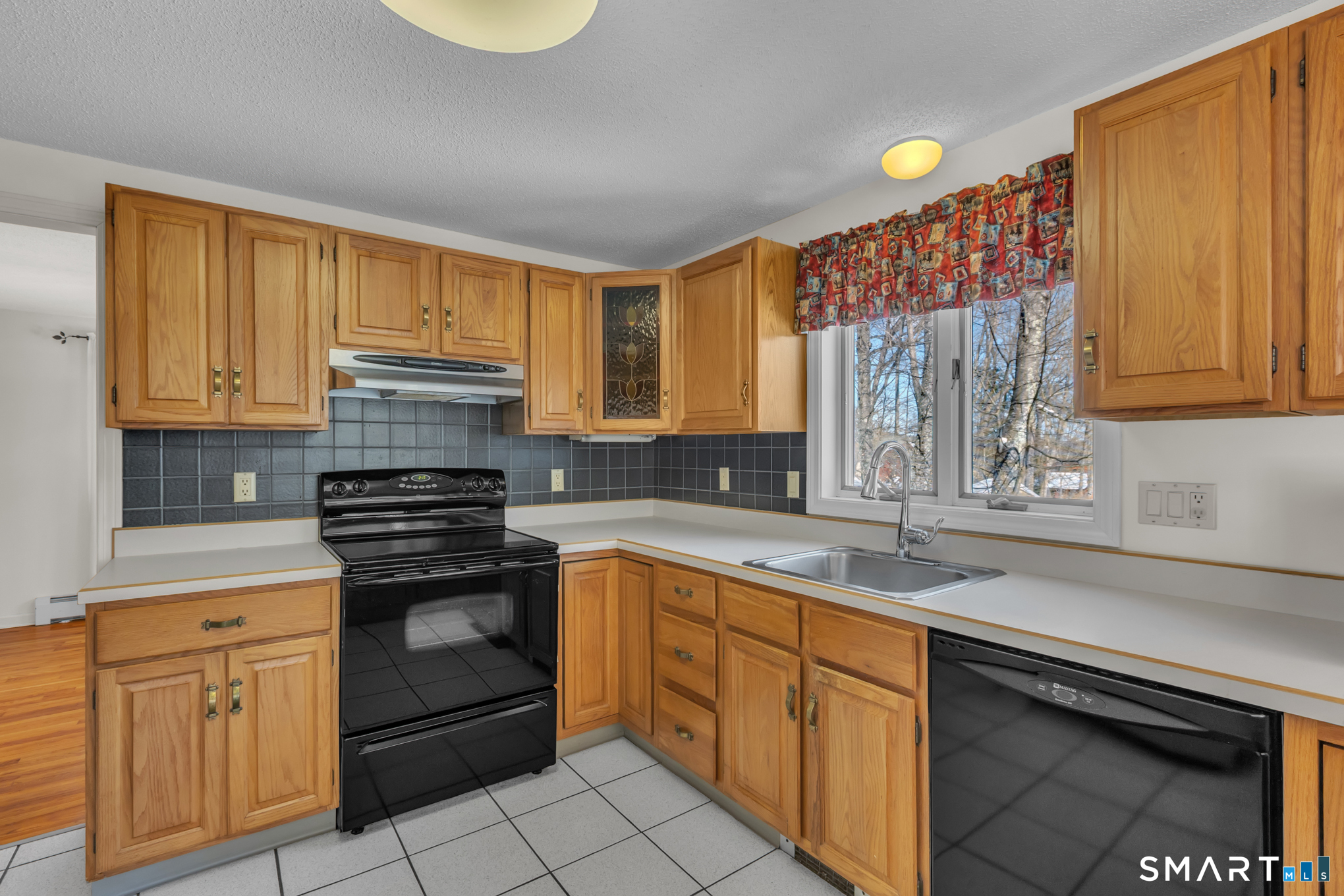 550 High Street Coventry, CT 06238 - Photo 12 of 35 a kitchen with a sink cabinets and window