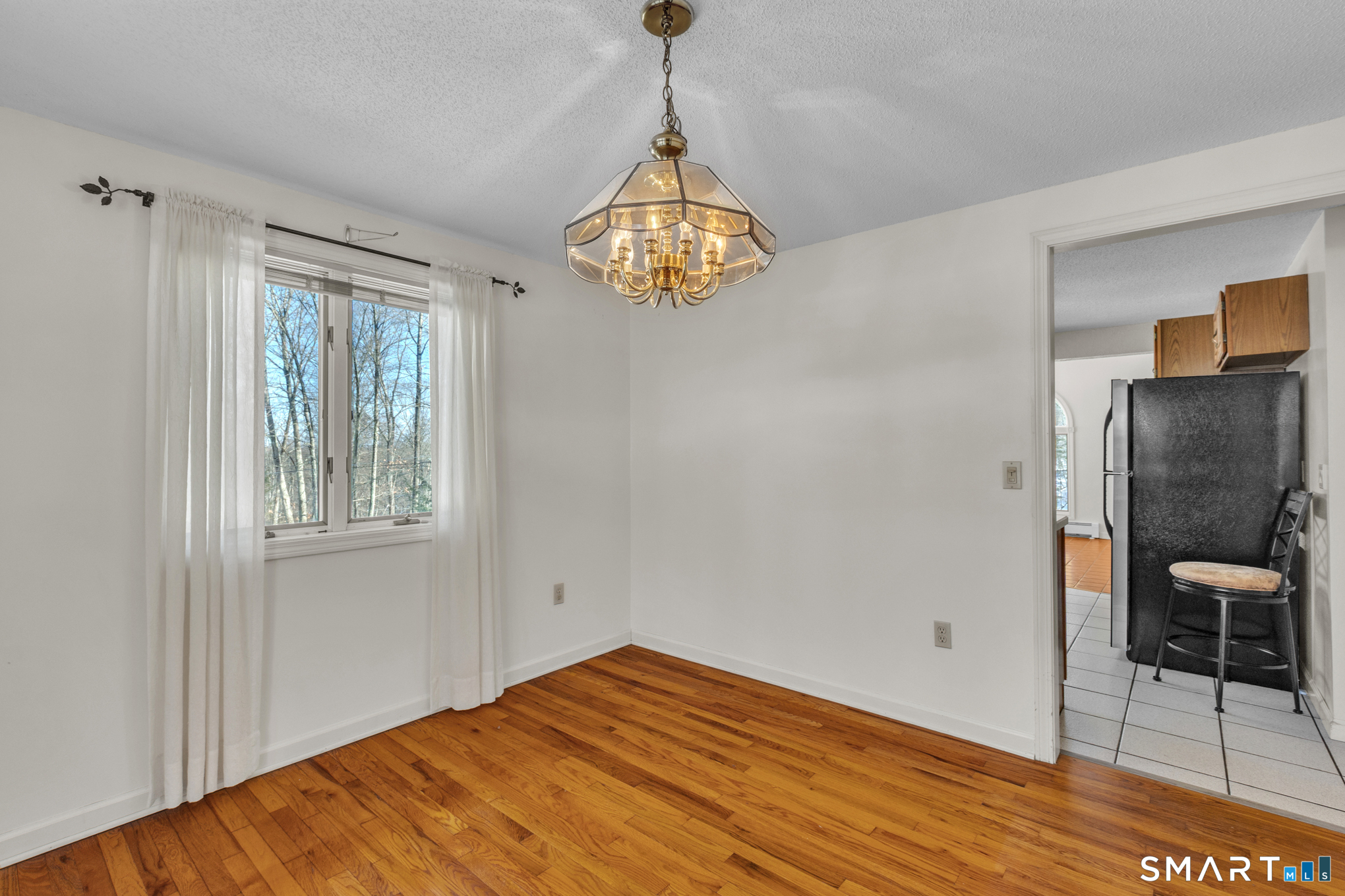 550 High Street Coventry, CT 06238 - Photo 17 of 35 a view of empty room with wooden floor and fan