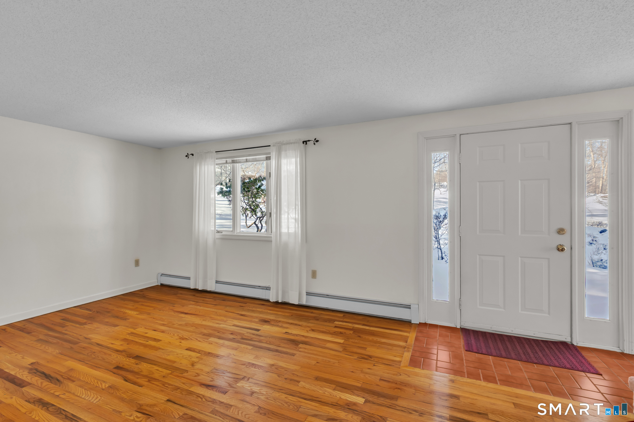 550 High Street Coventry, CT 06238 - Photo 19 of 35 a view of empty room with wooden floor and fan