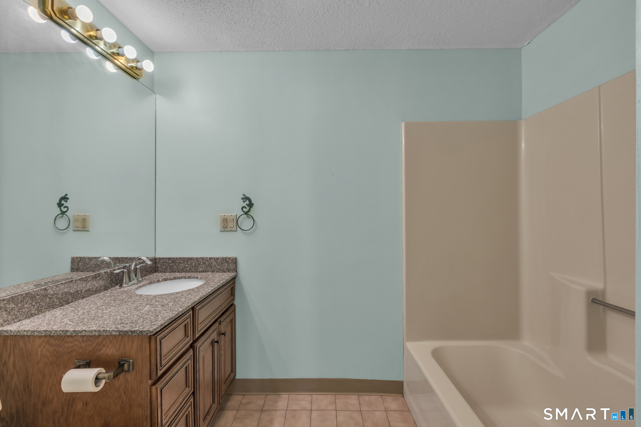 550 High Street Coventry, CT 06238 - Photo 20 of 35 a bathroom with a granite countertop sink a toilet and bathtub