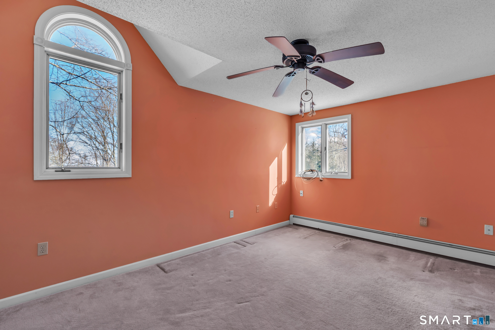 550 High Street Coventry, CT 06238 - Photo 24 of 35 an empty room with a window and a ceiling fan