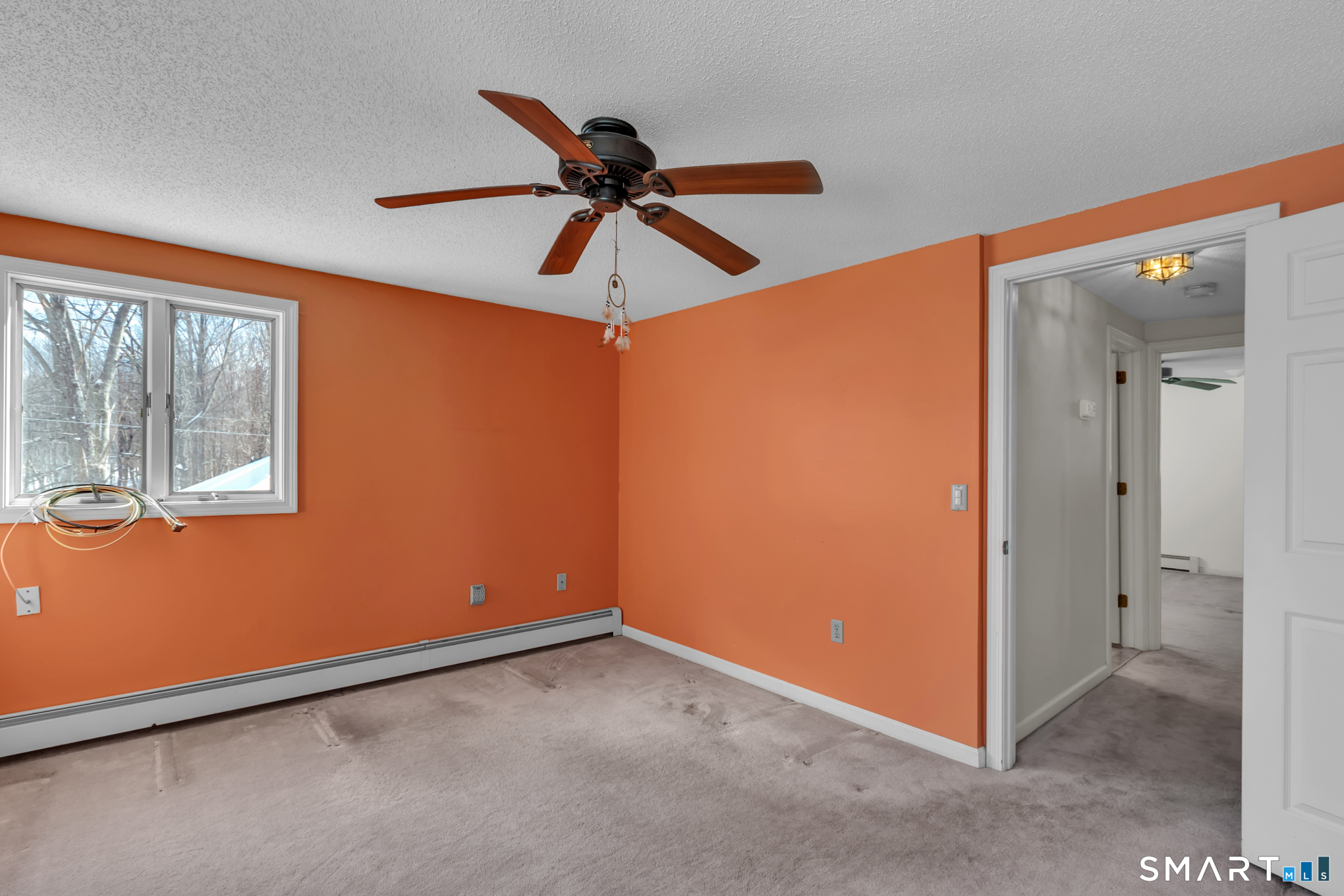 550 High Street Coventry, CT 06238 - Photo 26 of 35 an empty room with windows and fan