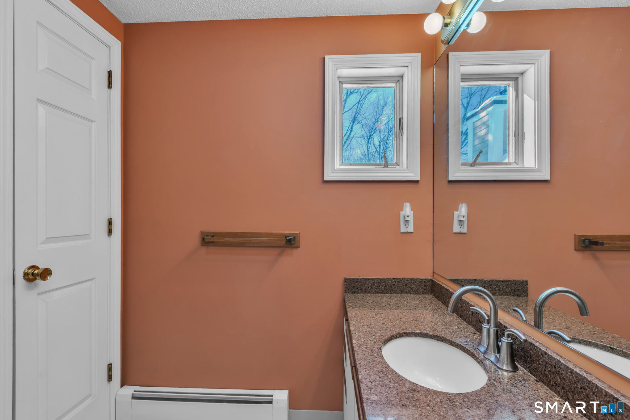 550 High Street Coventry, CT 06238 - Photo 27 of 35 a bathroom with a sink and mirror