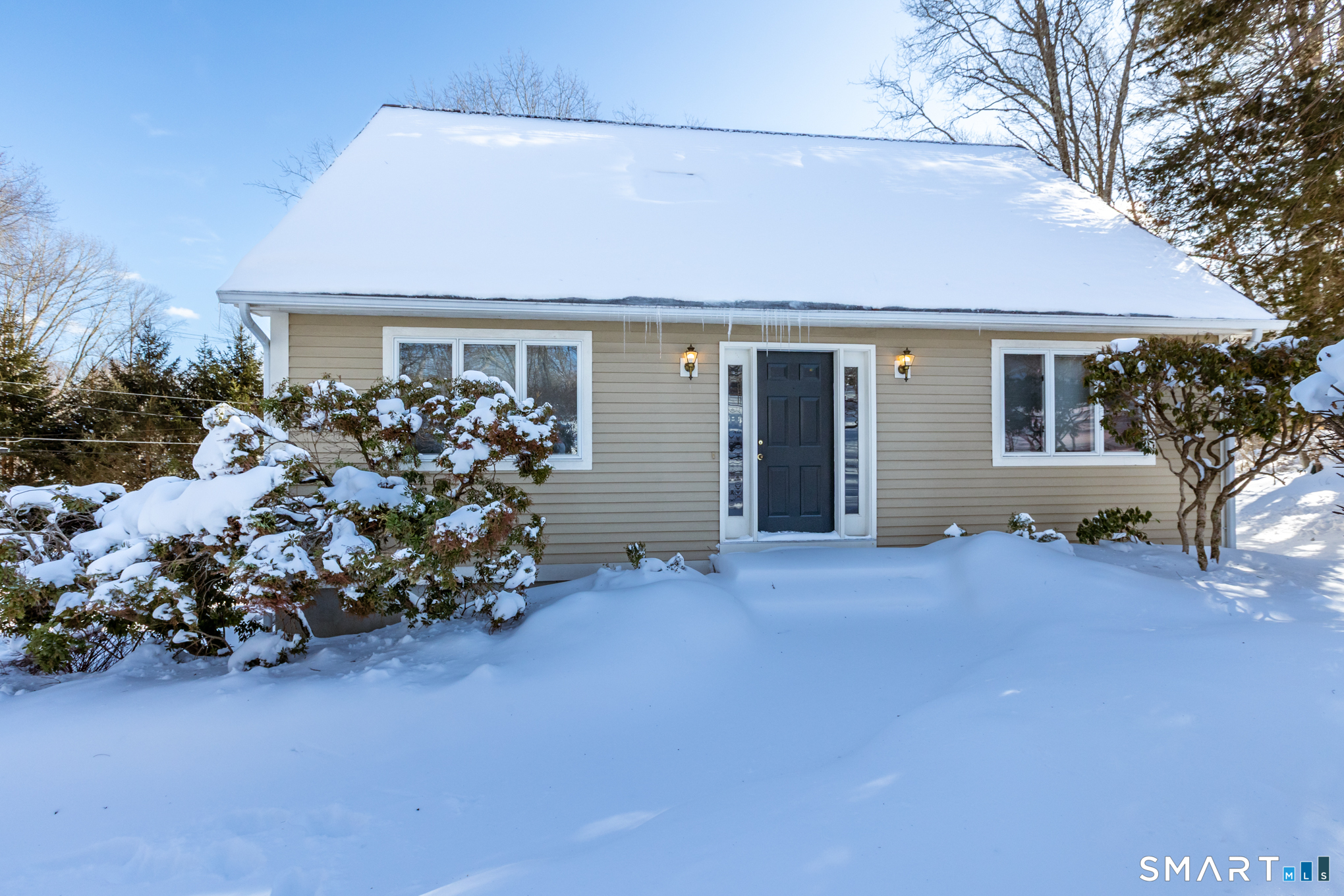 550 High Street Coventry, CT 06238 - Photo 3 of 35 a front view of a house with a yard and seating space