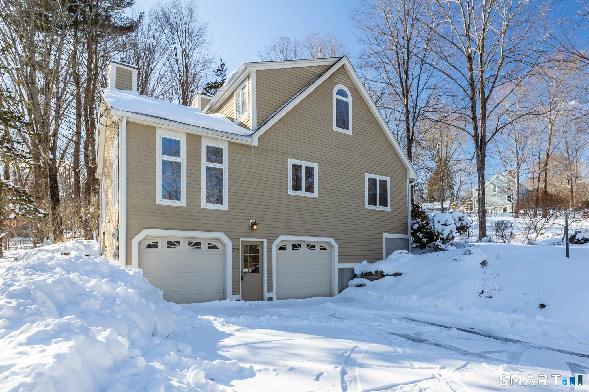 550 High Street Coventry, CT 06238 - Photo 5 of 35 a view of a house with a yard covered in snow