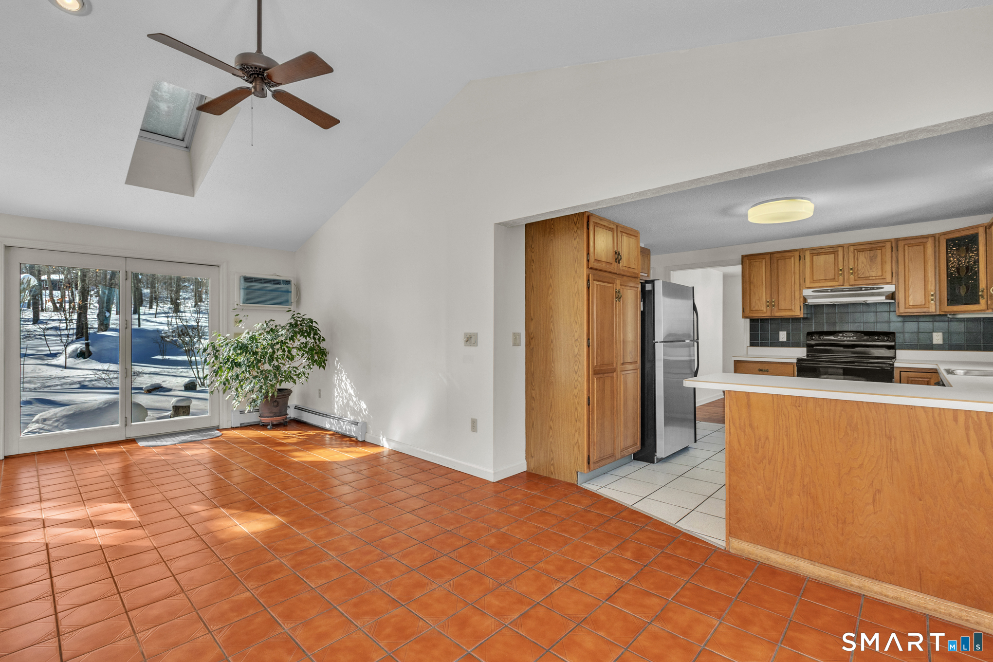 550 High Street Coventry, CT 06238 - Photo 10 of 35 a view of a kitchen with furniture and a ceiling fan