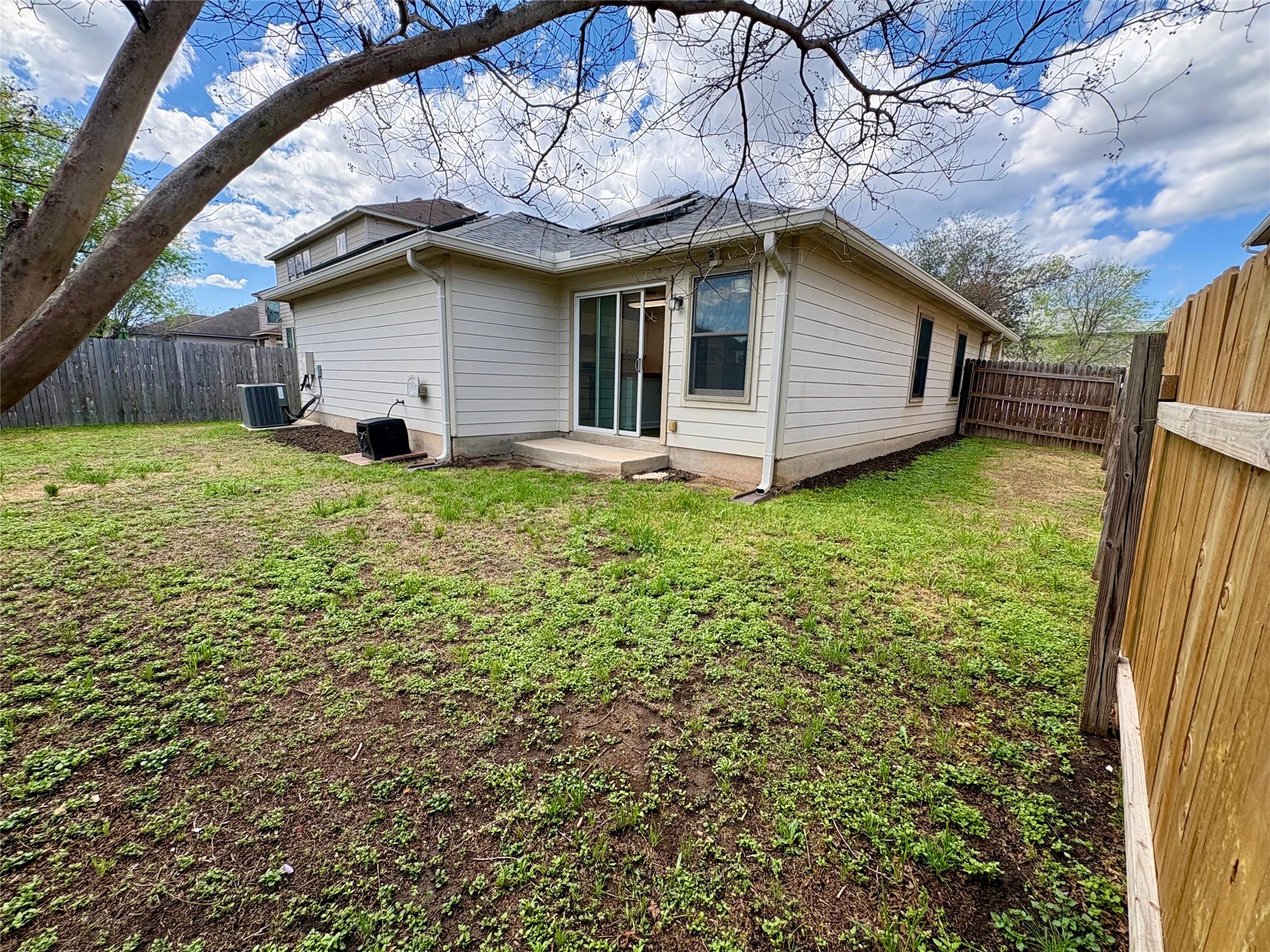 8003 Bannock Lane Austin, TX 78747 - Photo 36 of 40 Rear view of house featuring a fenced backyard