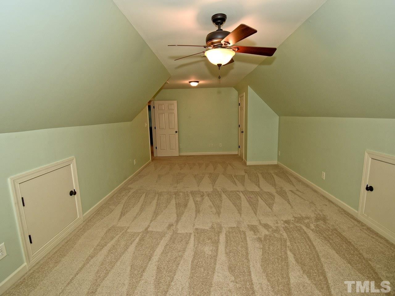 64 Hackney Trail Clayton, NC 27527 - Photo 26 of 30 a view of a room with a hanging light and kitchen