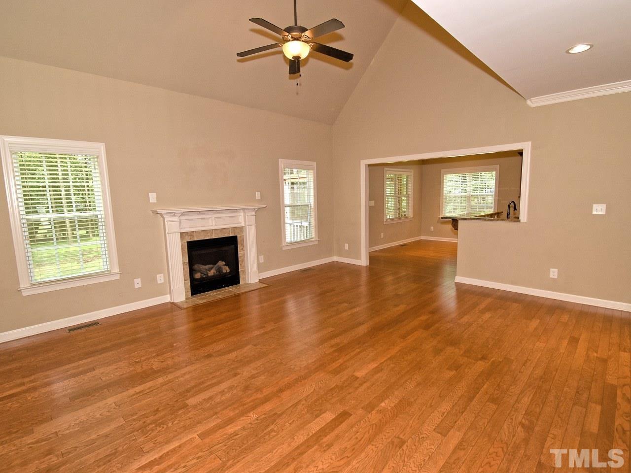 64 Hackney Trail Clayton, NC 27527 - Photo 8 of 30 a view of empty room with wooden floor and fan