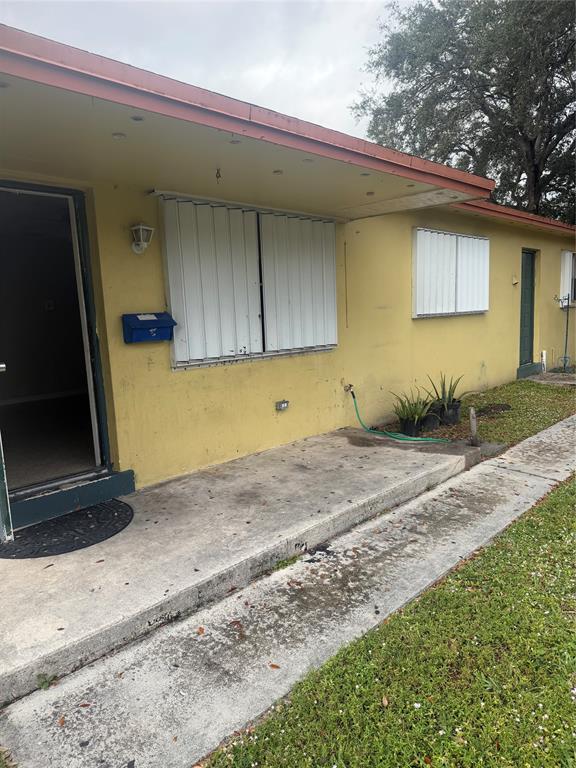 5738 Lincoln Street, Unit B Hollywood, FL 33021 - Photo 1 of 25 a view of garage and wooden door