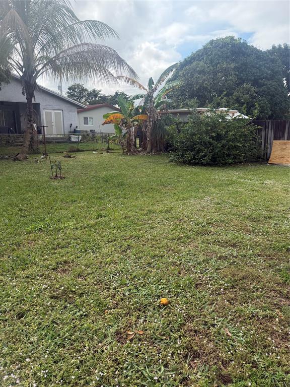 5738 Lincoln Street, Unit B Hollywood, FL 33021 - Photo 12 of 25 a view of a yard in front of the house