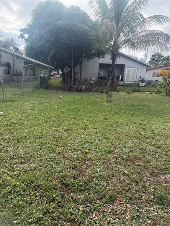 5738 Lincoln Street, Unit B Hollywood, FL 33021 - Photo 13 of 25 a view of a patio with table and chairs and potted plants
