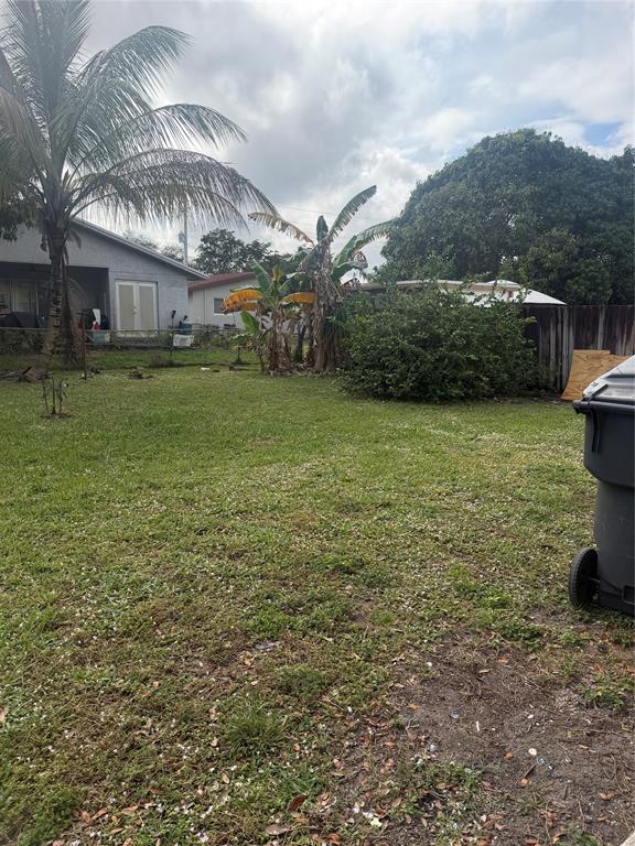 5738 Lincoln Street, Unit B Hollywood, FL 33021 - Photo 14 of 25 a view of a house with a yard