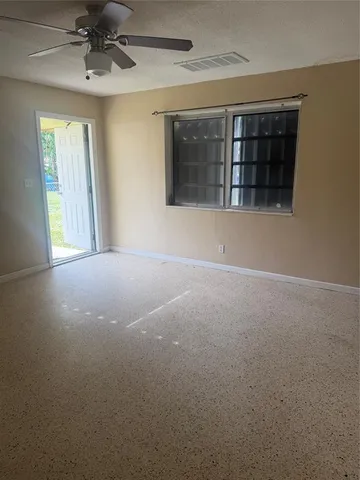 a view of an empty room with a window