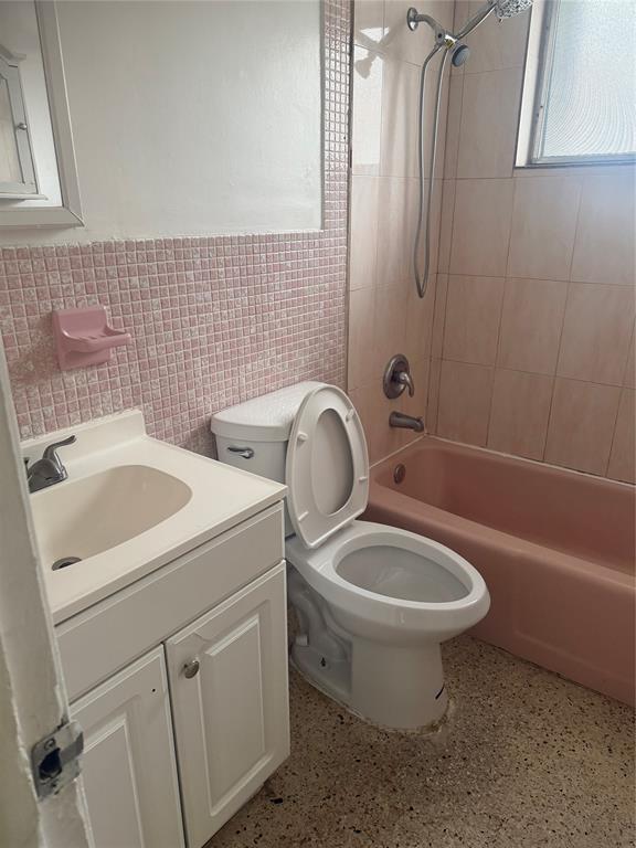 5738 Lincoln Street, Unit B Hollywood, FL 33021 - Photo 19 of 25 a bathroom with a toilet sink and mirror