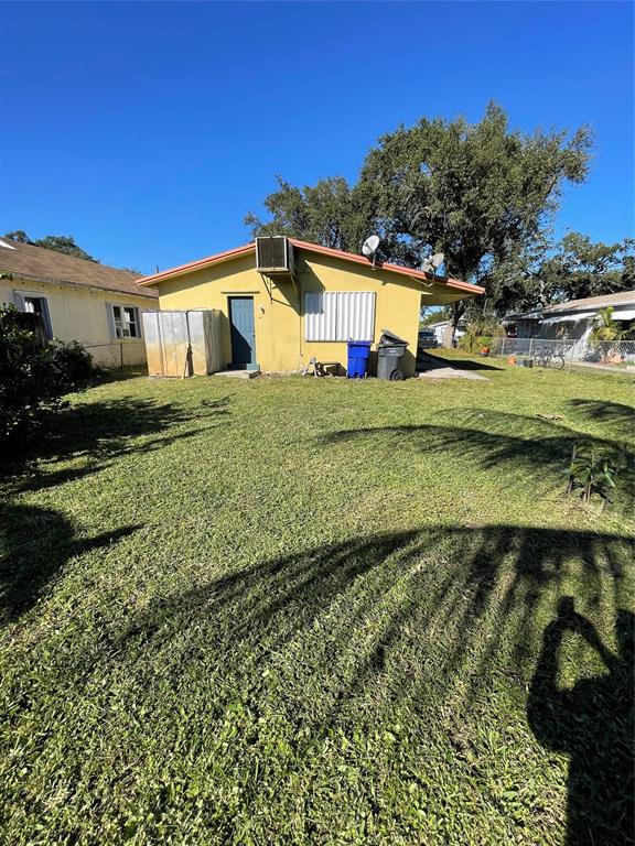 5738 Lincoln Street, Unit B Hollywood, FL 33021 - Photo 3 of 25 a front view of a house with a yard