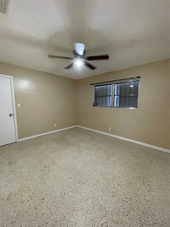 5738 Lincoln Street, Unit B Hollywood, FL 33021 - Photo 7 of 25 a view of an empty room and chandelier fan