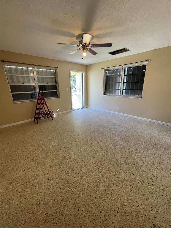 5738 Lincoln Street, Unit B Hollywood, FL 33021 - Photo 9 of 25 a view of a livingroom with a ceiling fan and window