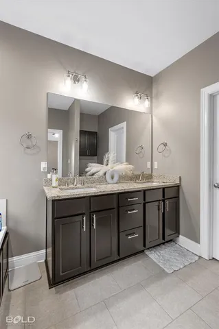 a bedroom with bed and ceiling fan