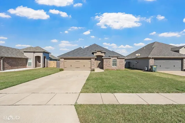 a kitchen that has a sink and cabinets