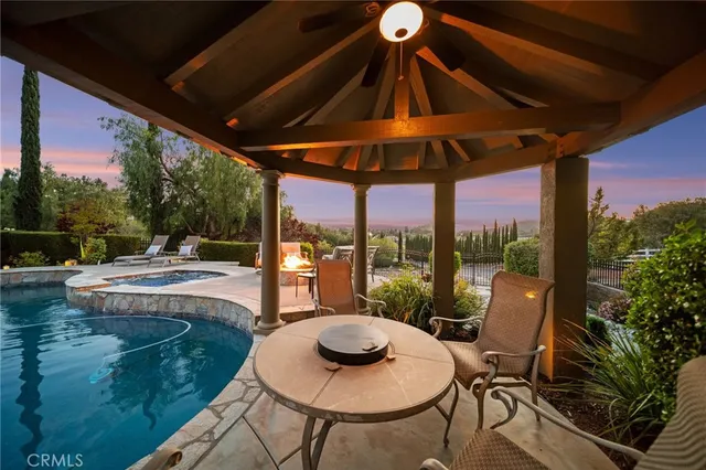 a view of a swimming pool with a patio
