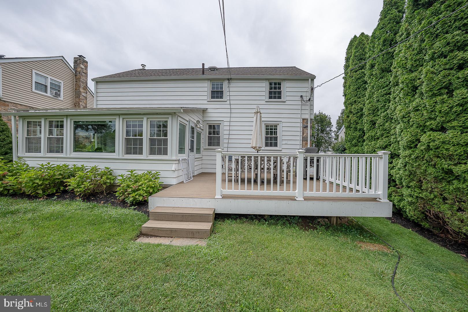 220 Dorset Road Devon, PA 19333 - Photo 3 of 32 a view of a house with a deck and a yard