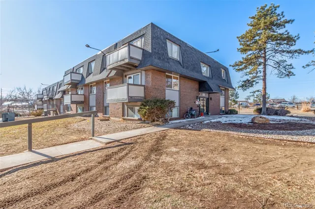 a view of a building with a yard