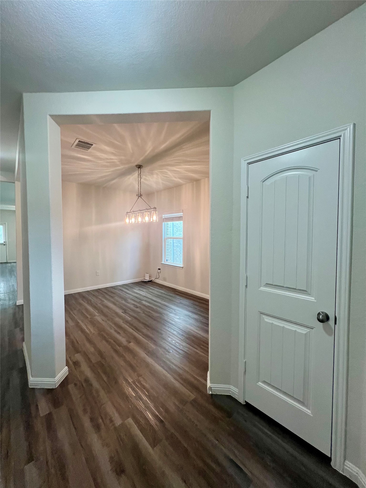 104 Moravia Road Georgetown, TX 78626 - Photo 6 of 36 An inviting entryway seamlessly flows into a spacious dining area, perfect for entertaining.