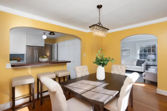 a kitchen with a sink a stove and a refrigerator