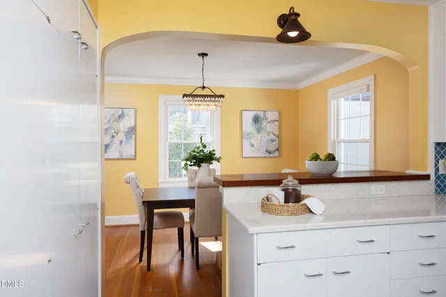 a kitchen with a sink and a refrigerator