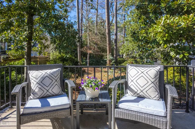 a bathroom with a shower toilet and a window