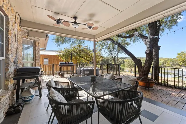 a view of a patio with a table and chairs