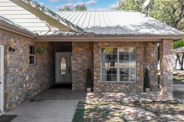 a view of a porch with furniture and shower