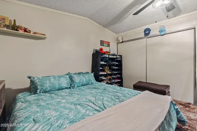 a bedroom with a bed and a closet