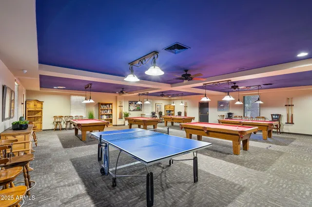 a room with lots of furniture and view of living room