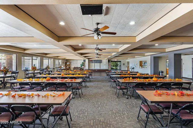 a living room with lots of furniture and chandelier
