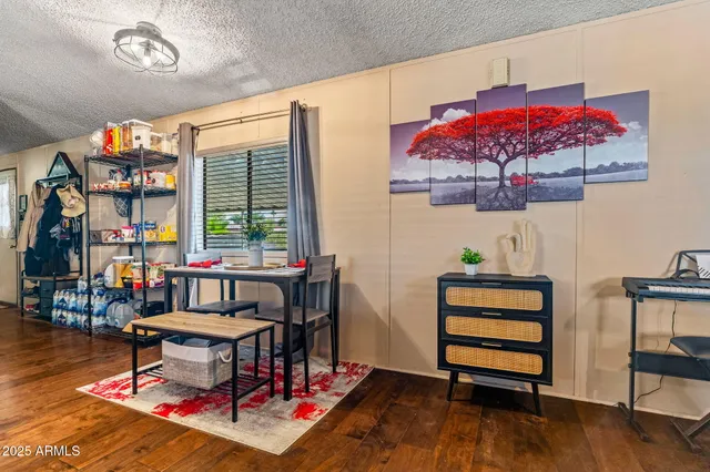 a living room with furniture a rug and a chandelier