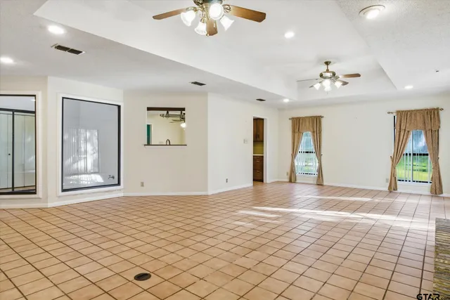 a kitchen with stainless steel appliances a stove refrigerator and microwave