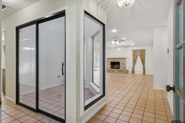 a large bedroom with a large bed and a large window