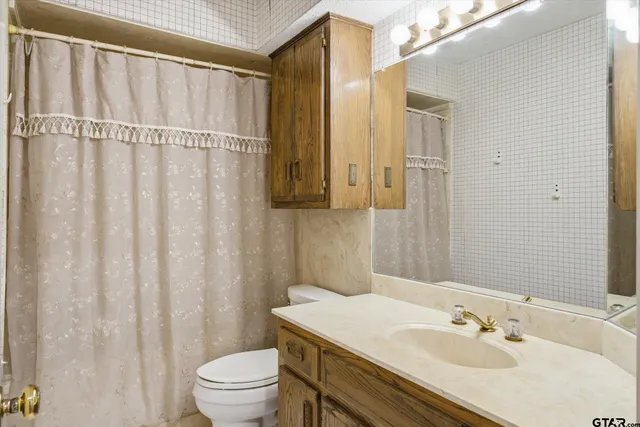 a view of a livingroom with furniture and chandelier