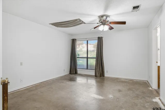 a bathroom with a shower and a sink