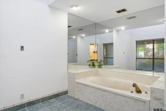 a view of a house with pool and chairs