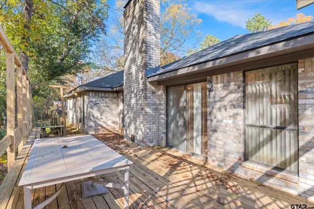 a view of a backyard with wooden fence