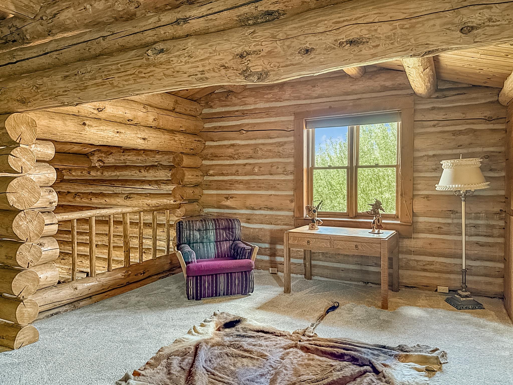 9709 3605 Road Hotchkiss, CO 81419 - Photo 21 of 42 a bedroom with furniture and a window