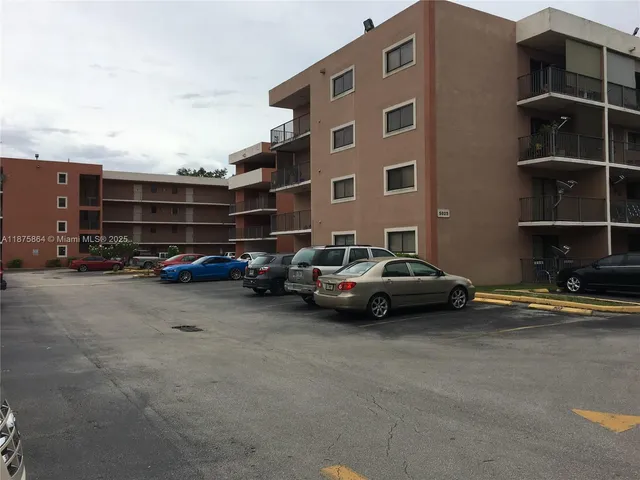 a backyard of a house with lots of green space and garden
