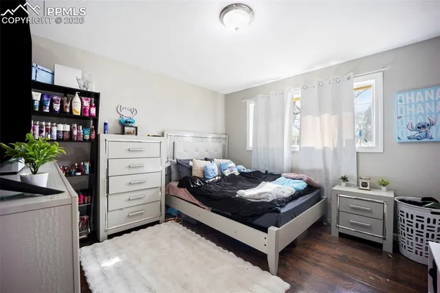 a bedroom with furniture and a window