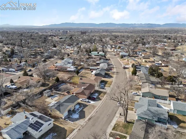 an aerial view of residential building with parking space