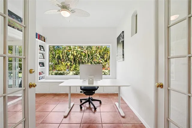 a view of a house with swimming pool and sitting area
