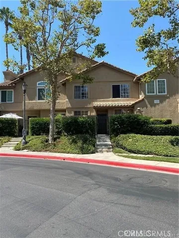 a house that has a tree in front of it