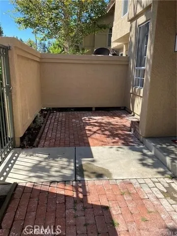 a view of a backyard of the house